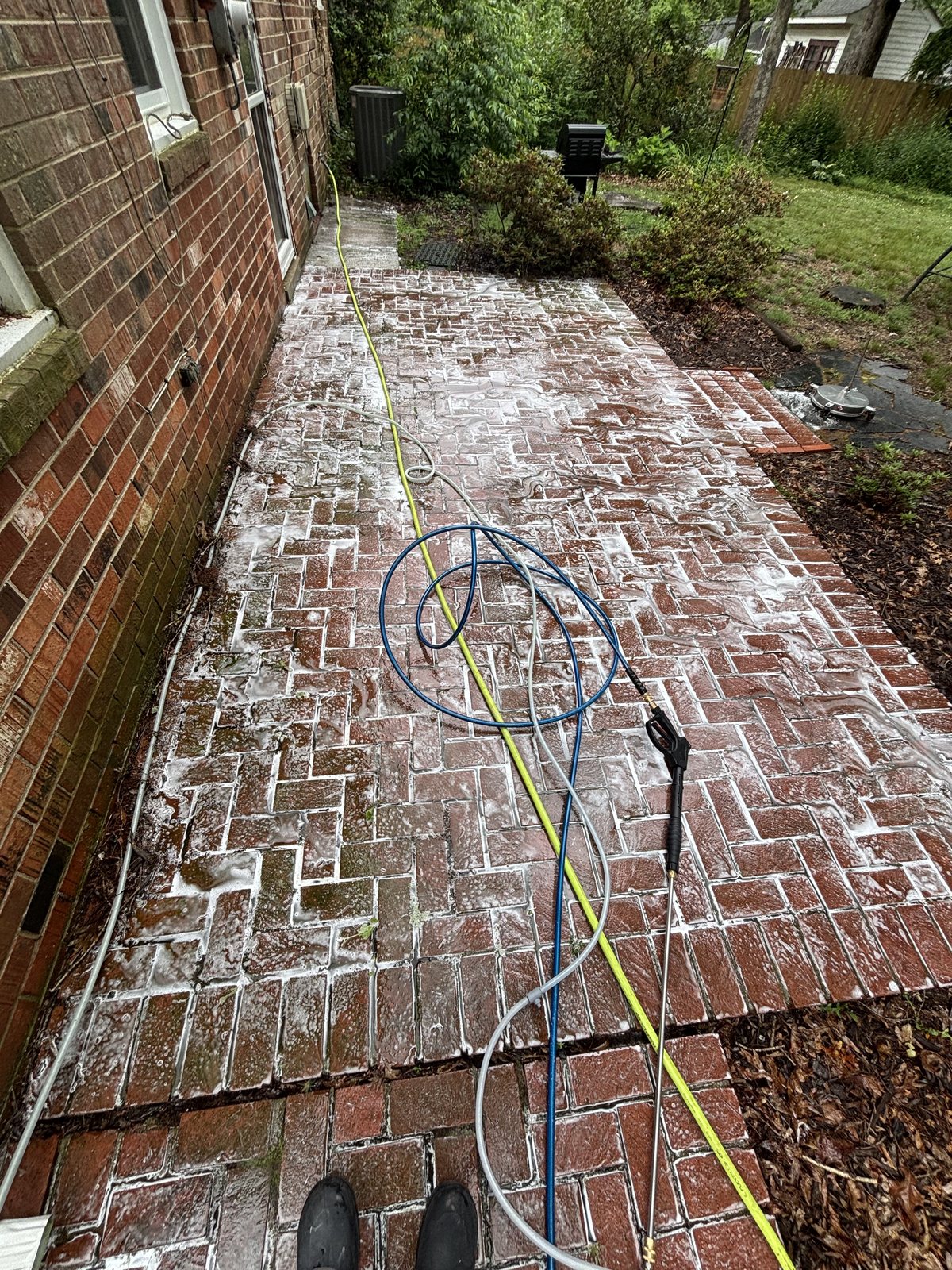 Brick walkway being cleaned